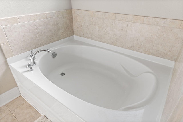 7045 Leisure St, Navarre, FL 32566 - full bathroom featuring a garden tub and tile patterned flooring