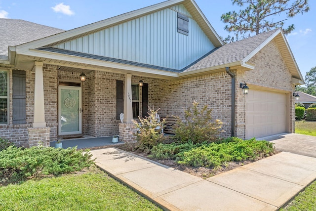 7045 Leisure St, Navarre, FL 32566 - view of front of house featuring board and batten siding, brick siding, and an attached garage