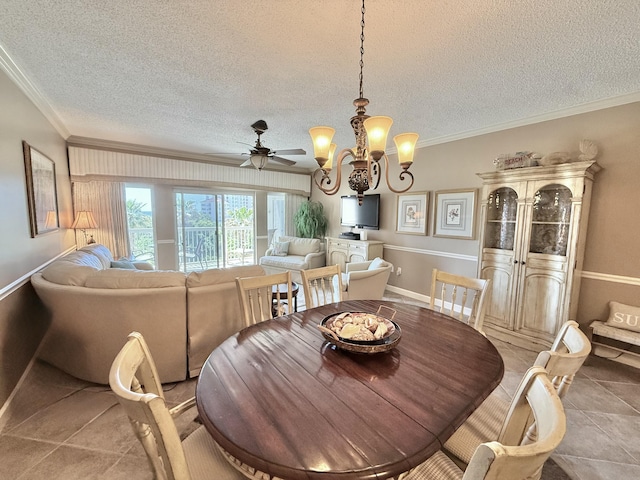 dining space with light tile patterned floors, crown molding, baseboards, a textured ceiling, and ceiling fan with notable chandelier