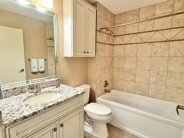 bathroom featuring tile patterned flooring, toilet, shower / bath combination, and vanity