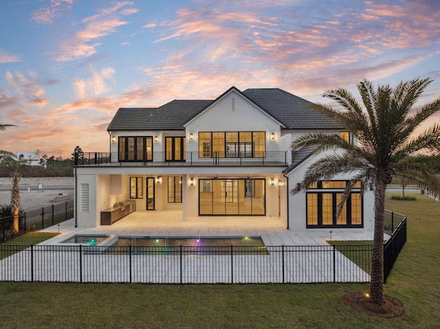 724 Windsong Dr, Inlet Beach, FL 32461 - back of house featuring a fenced backyard, a balcony, a patio, stucco siding, and an outdoor living space
