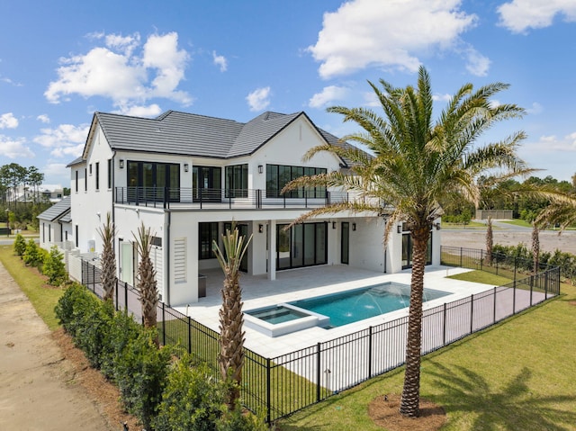 724 Windsong Dr, Inlet Beach, FL 32461 - rear view of house with a fenced backyard, a balcony, a yard, and stucco siding