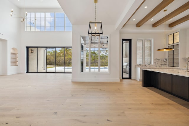 724 Windsong Dr, Inlet Beach, FL 32461 - entrance foyer with plenty of natural light, baseboards, and an inviting chandelier