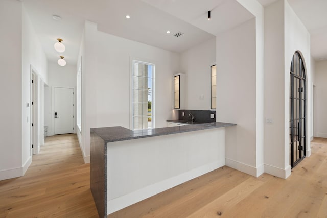 724 Windsong Dr, Inlet Beach, FL 32461 - kitchen with light wood finished floors and baseboards