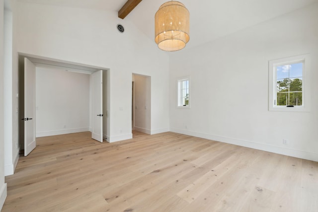 724 Windsong Dr, Inlet Beach, FL 32461 - unfurnished room with beamed ceiling, baseboards, high vaulted ceiling, and light wood-type flooring
