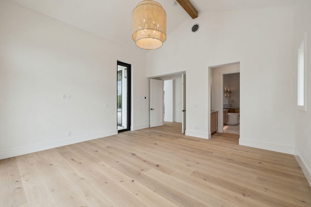 724 Windsong Dr, Inlet Beach, FL 32461 - empty room with high vaulted ceiling, baseboards, beam ceiling, and light wood-type flooring