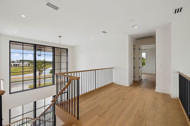 724 Windsong Dr, Inlet Beach, FL 32461 - hallway with recessed lighting, visible vents, light wood finished floors, and an upstairs landing