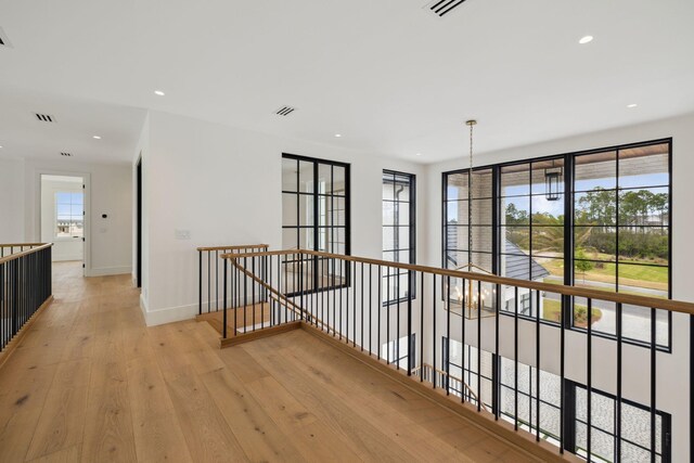 724 Windsong Dr, Inlet Beach, FL 32461 - hallway with recessed lighting, visible vents, an upstairs landing, light wood-style floors, and baseboards