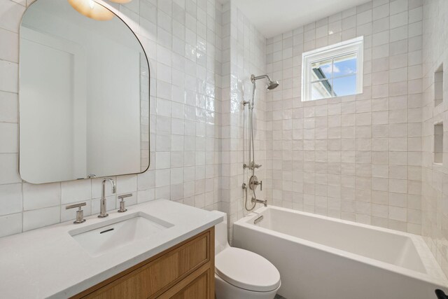 724 Windsong Dr, Inlet Beach, FL 32461 - bathroom with toilet, tile walls, shower / washtub combination, decorative backsplash, and vanity