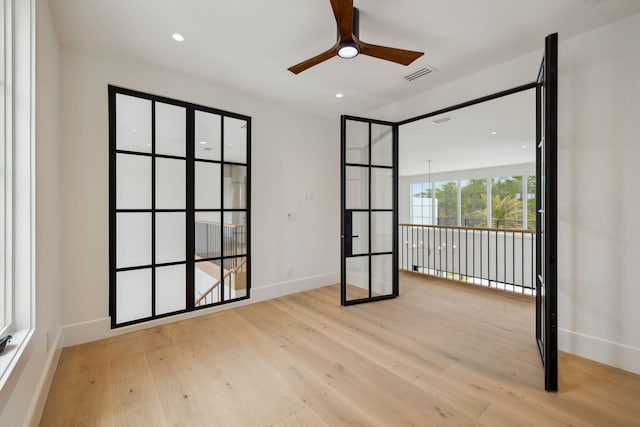 724 Windsong Dr, Inlet Beach, FL 32461 - spare room with baseboards, a ceiling fan, wood finished floors, and visible vents