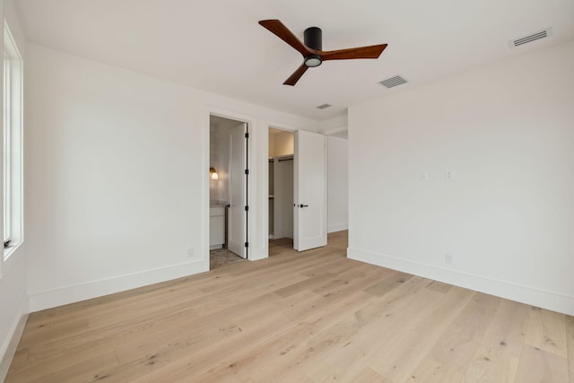 724 Windsong Dr, Inlet Beach, FL 32461 - unfurnished bedroom with a spacious closet, baseboards, light wood finished floors, and visible vents