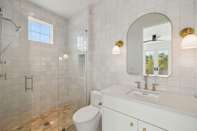 724 Windsong Dr, Inlet Beach, FL 32461 - bathroom with toilet, tile walls, a ceiling fan, a shower stall, and vanity