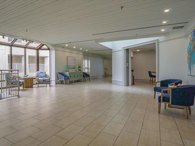 4214 Beachside Two Dr # 214, Miramar Beach, FL 32550 - building lobby featuring a wall of windows, wooden ceiling, and recessed lighting