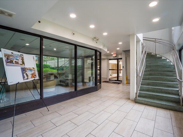 4214 Beachside Two Dr # 214, Miramar Beach, FL 32550 - empty room featuring plenty of natural light, stairway, and recessed lighting