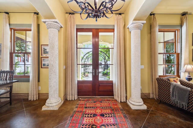 30 Place De La Fontaine, Miramar Beach, FL 32550 - entrance foyer with ornate columns, french doors, and a notable chandelier