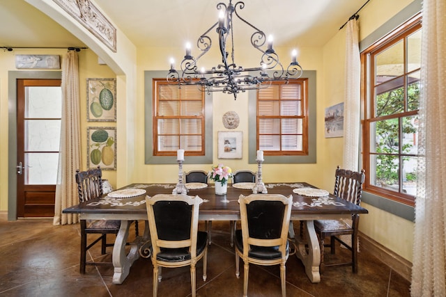 30 Place De La Fontaine, Miramar Beach, FL 32550 - dining space featuring arched walkways and a notable chandelier