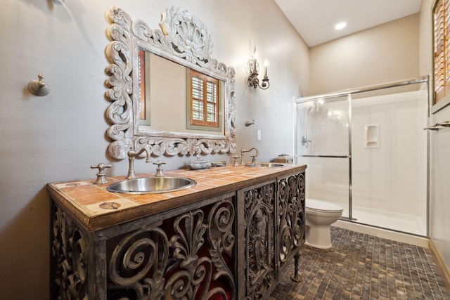 30 Place De La Fontaine, Miramar Beach, FL 32550 - full bathroom with tile patterned floors, double vanity, toilet, a sink, and a stall shower