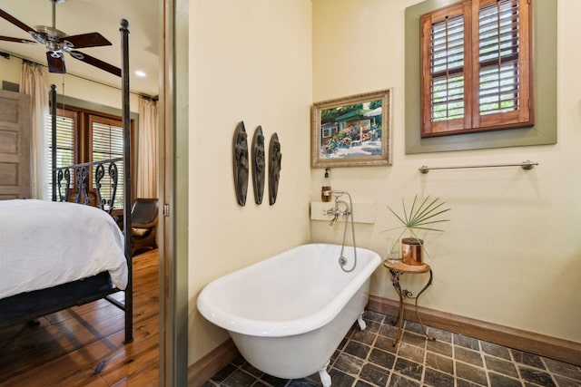 30 Place De La Fontaine, Miramar Beach, FL 32550 - ensuite bathroom featuring baseboards, a ceiling fan, and plenty of natural light