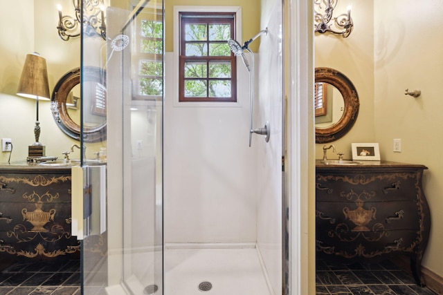 30 Place De La Fontaine, Miramar Beach, FL 32550 - bathroom featuring a stall shower, baseboards, vanity, and stone finish flooring