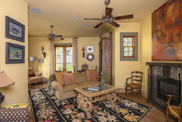 30 Place De La Fontaine, Miramar Beach, FL 32550 - living room featuring a fireplace, tile patterned floors, a ceiling fan, and baseboards