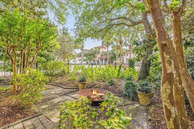 30 Place De La Fontaine, Miramar Beach, FL 32550 - view of yard featuring a patio, a fire pit, and fence