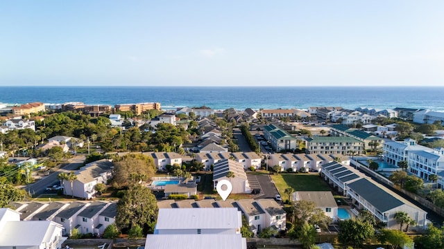 birds eye view of property featuring a water view and a residential view