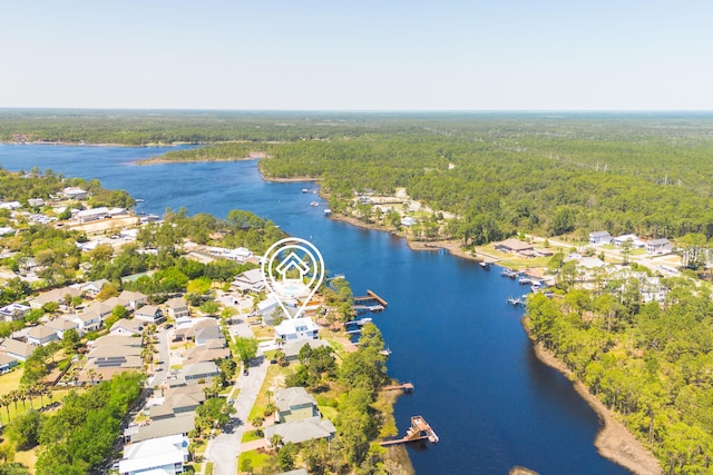 aerial view featuring a view of trees and a water view