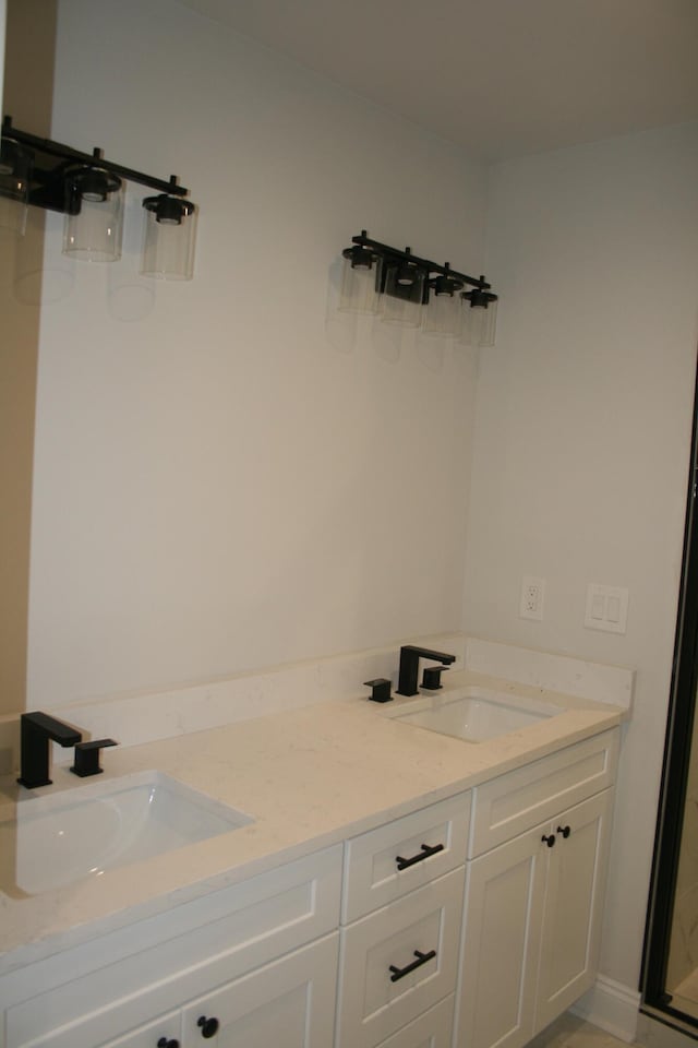 376 Shorey Dr, Defuniak Springs, FL 32433 - full bathroom with double vanity and a shower with shower door