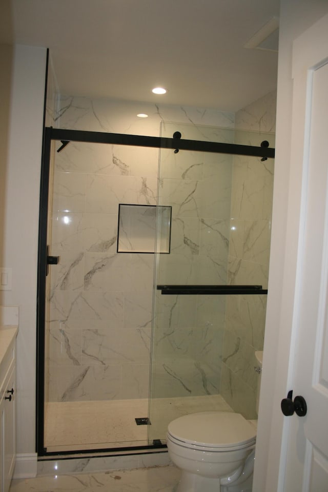 376 Shorey Dr, Defuniak Springs, FL 32433 - bathroom with marble finish floors, vanity, toilet, a marble finish shower, and recessed lighting