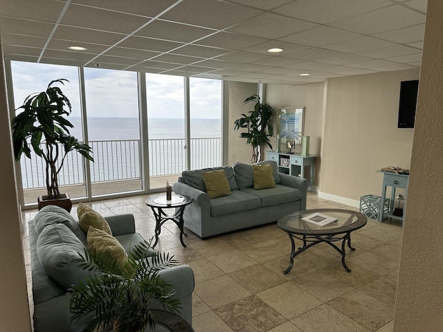 16819 Front Beach Rd Unit 1110, Panama City Beach, FL 32413 - living room with floor to ceiling windows, a drop ceiling, baseboards, and recessed lighting