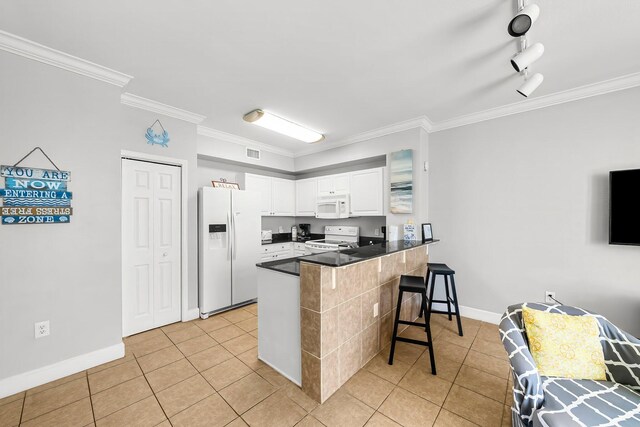 16819 Front Beach Rd Unit 1110, Panama City Beach, FL 32413 - kitchen with a peninsula, dark countertops, ornamental molding, and white appliances