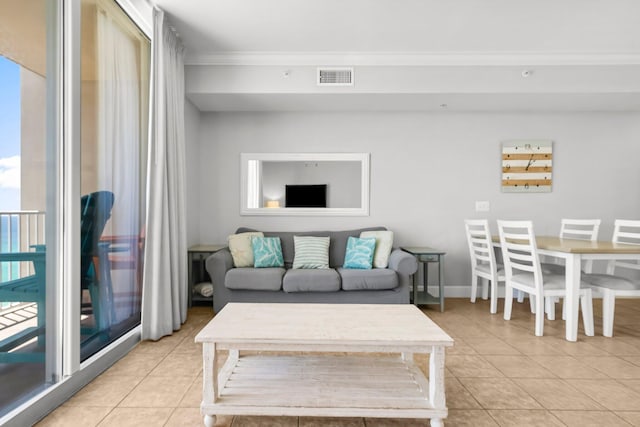 16819 Front Beach Rd Unit 1110, Panama City Beach, FL 32413 - living room with visible vents, light tile patterned flooring, and ornamental molding