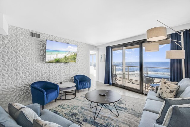 4260 Beachside Two Unit 4260, Miramar Beach, FL 32550 - living room featuring wallpapered walls, light wood-style floors, and baseboards