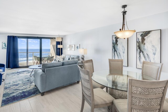 4260 Beachside Two Unit 4260, Miramar Beach, FL 32550 - dining space with a water view and light wood finished floors