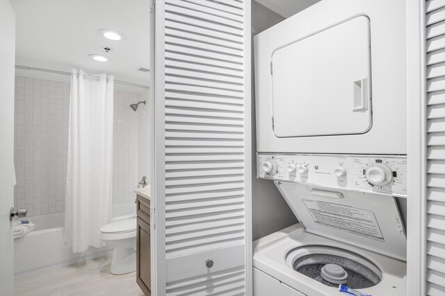 4260 Beachside Two Unit 4260, Miramar Beach, FL 32550 - washroom featuring estacked washer and dryer and recessed lighting