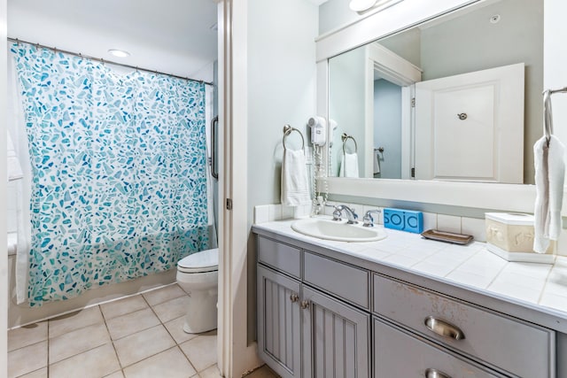 9200 Baytowne Wharf Blvd Unit 441, Miramar Beach, FL 32550 - bathroom with toilet, tile patterned floors, vanity, and shower / bathtub combination with curtain