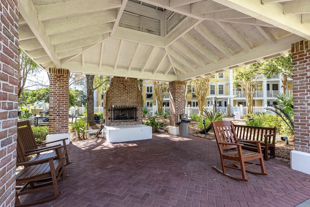 9200 Baytowne Wharf Blvd Unit 441, Miramar Beach, FL 32550 - view of patio with an outdoor brick fireplace and a gazebo