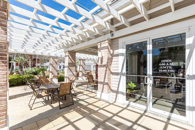 9200 Baytowne Wharf Blvd Unit 441, Miramar Beach, FL 32550 - view of patio / terrace with a pergola, outdoor dining space, and french doors