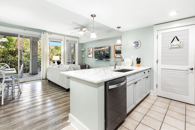 9200 Baytowne Wharf Blvd Unit 441, Miramar Beach, FL 32550 - kitchen with dishwasher, a sink, a ceiling fan, a peninsula, and hanging light fixtures