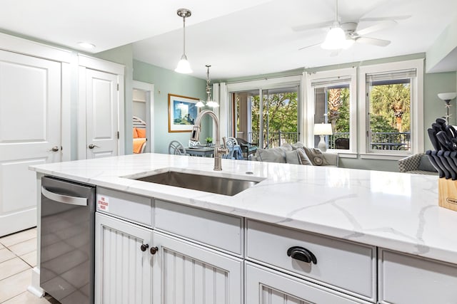 9200 Baytowne Wharf Blvd Unit 441, Miramar Beach, FL 32550 - kitchen featuring dishwasher, a sink, light tile patterned floors, white cabinets, and open floor plan