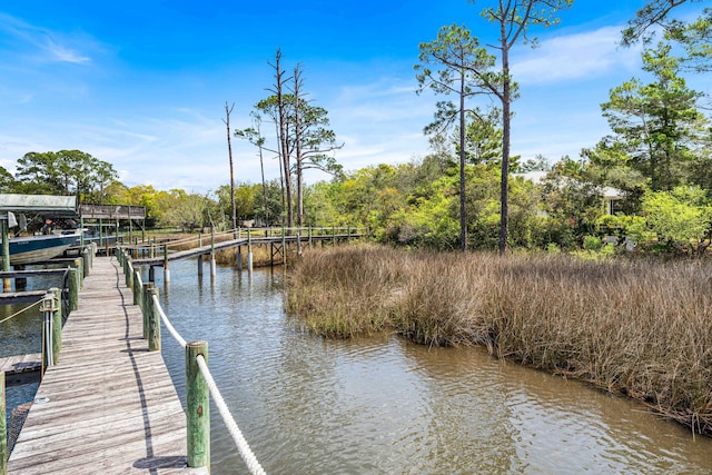 135 Bayou Point Dr, Santa Rosa Beach, FL 32459 - view of dock with boat lift and a water view