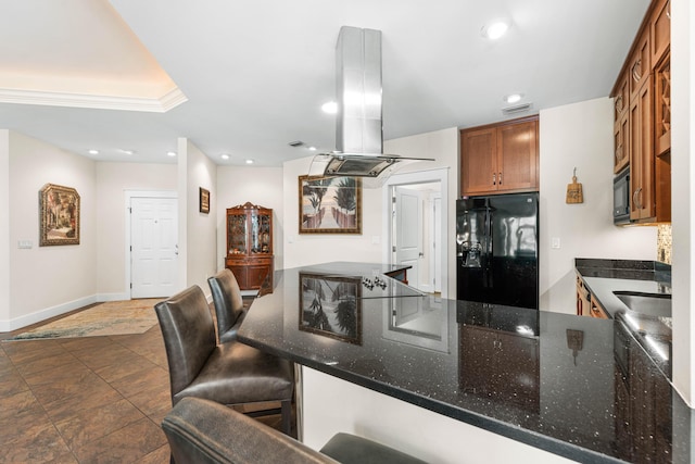 135 Bayou Point Dr, Santa Rosa Beach, FL 32459 - kitchen featuring recessed lighting, dark stone countertops, island range hood, black appliances, and a peninsula
