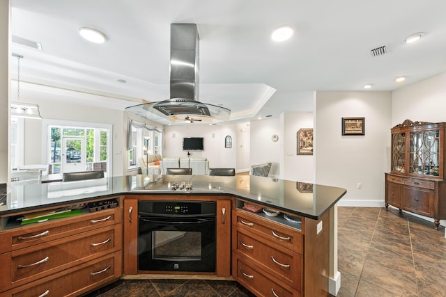 135 Bayou Point Dr, Santa Rosa Beach, FL 32459 - kitchen with island exhaust hood, dark countertops, visible vents, black appliances, and open floor plan