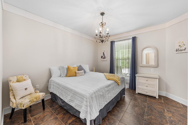135 Bayou Point Dr, Santa Rosa Beach, FL 32459 - bedroom featuring a chandelier, stone finish floor, and baseboards