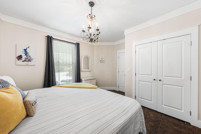 135 Bayou Point Dr, Santa Rosa Beach, FL 32459 - bedroom with baseboards, a notable chandelier, and a closet