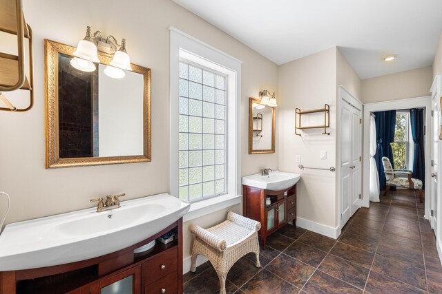 135 Bayou Point Dr, Santa Rosa Beach, FL 32459 - bathroom with two vanities, baseboards, and a sink