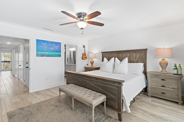 bedroom featuring ceiling fan, light wood finished floors, baseboards, ornamental molding, and visible vents