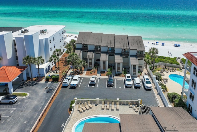 bird's eye view featuring a beach view and a water view