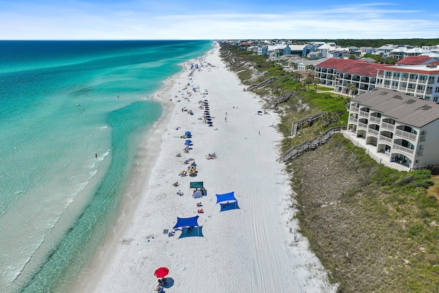 birds eye view of property featuring a view of the beach and a water view