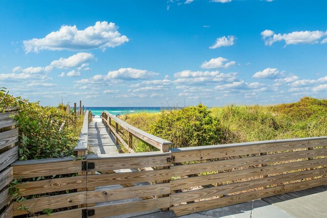 exterior space with a beach view and a water view